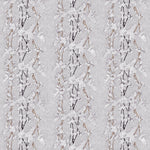 Detail of fabric in a striped wisteria print in shades of white and brown on a light gray field.