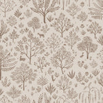 Detail of wallpaper in a playful animal and tree print in brown on a cream field.