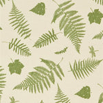 Detail of fabric in a scattered fern leaf print in green on a cream field.