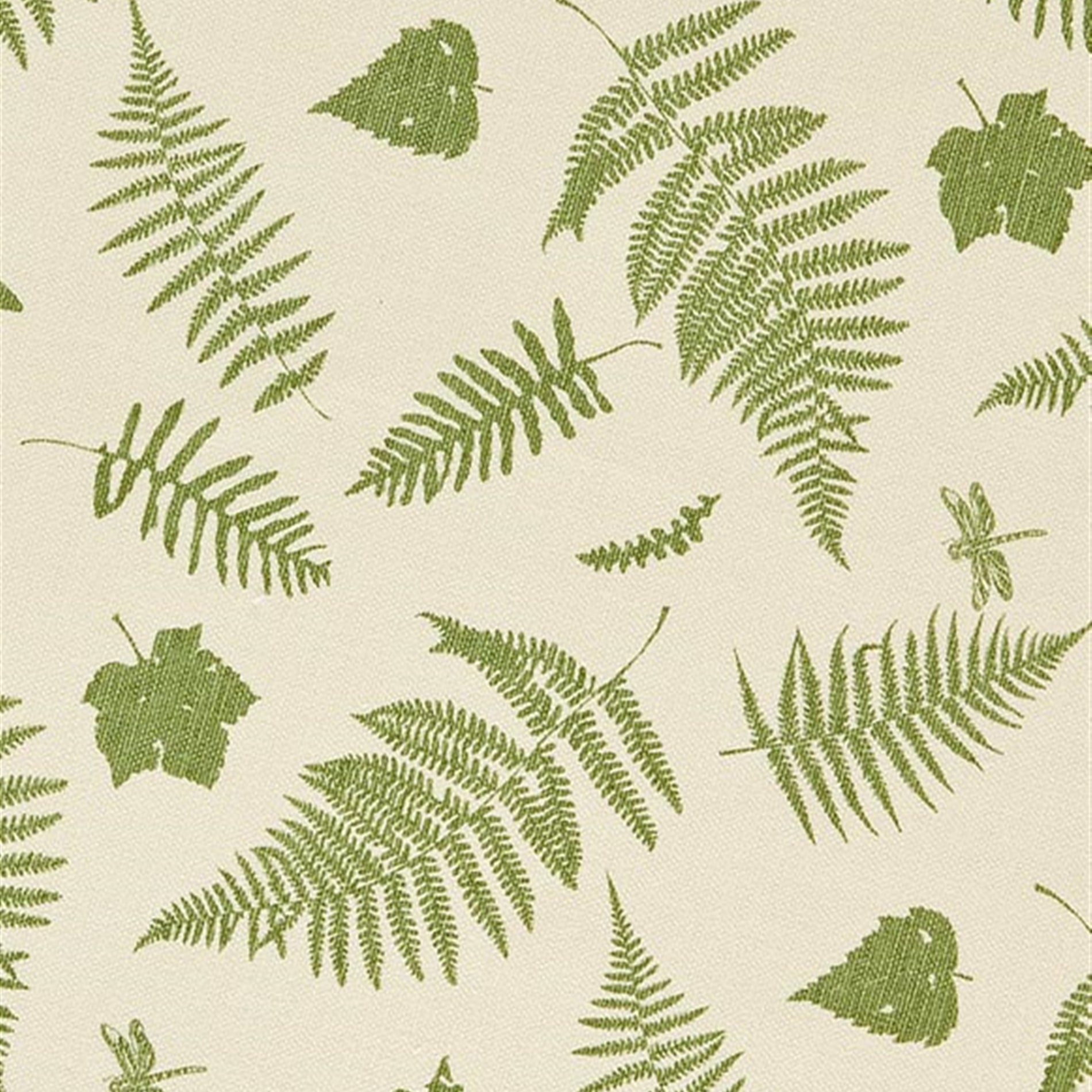 Detail of fabric in a scattered fern leaf print in green on a cream field.