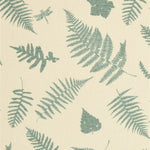 Detail of fabric in a scattered fern leaf print in blue-gray on a cream field.