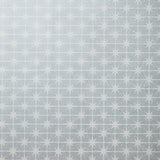 Detail of wallpaper in a geometric damask print in cream on a light blue field.