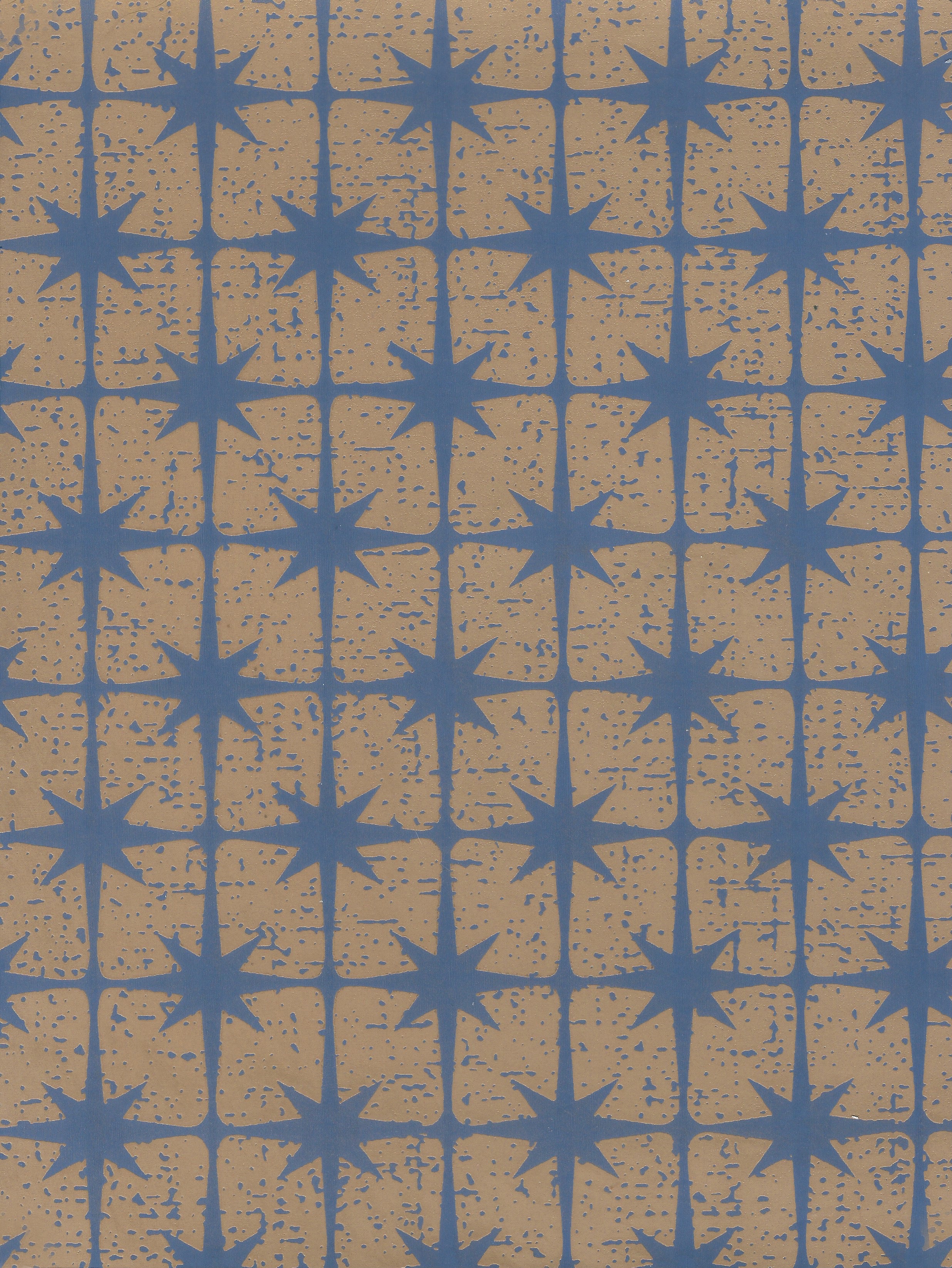 Detail of wallpaper in a geometric damask print in blue on a gold field.