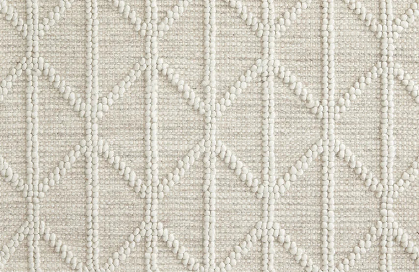 Broadloom carpet swatch in a diamond textured pattern in a white design