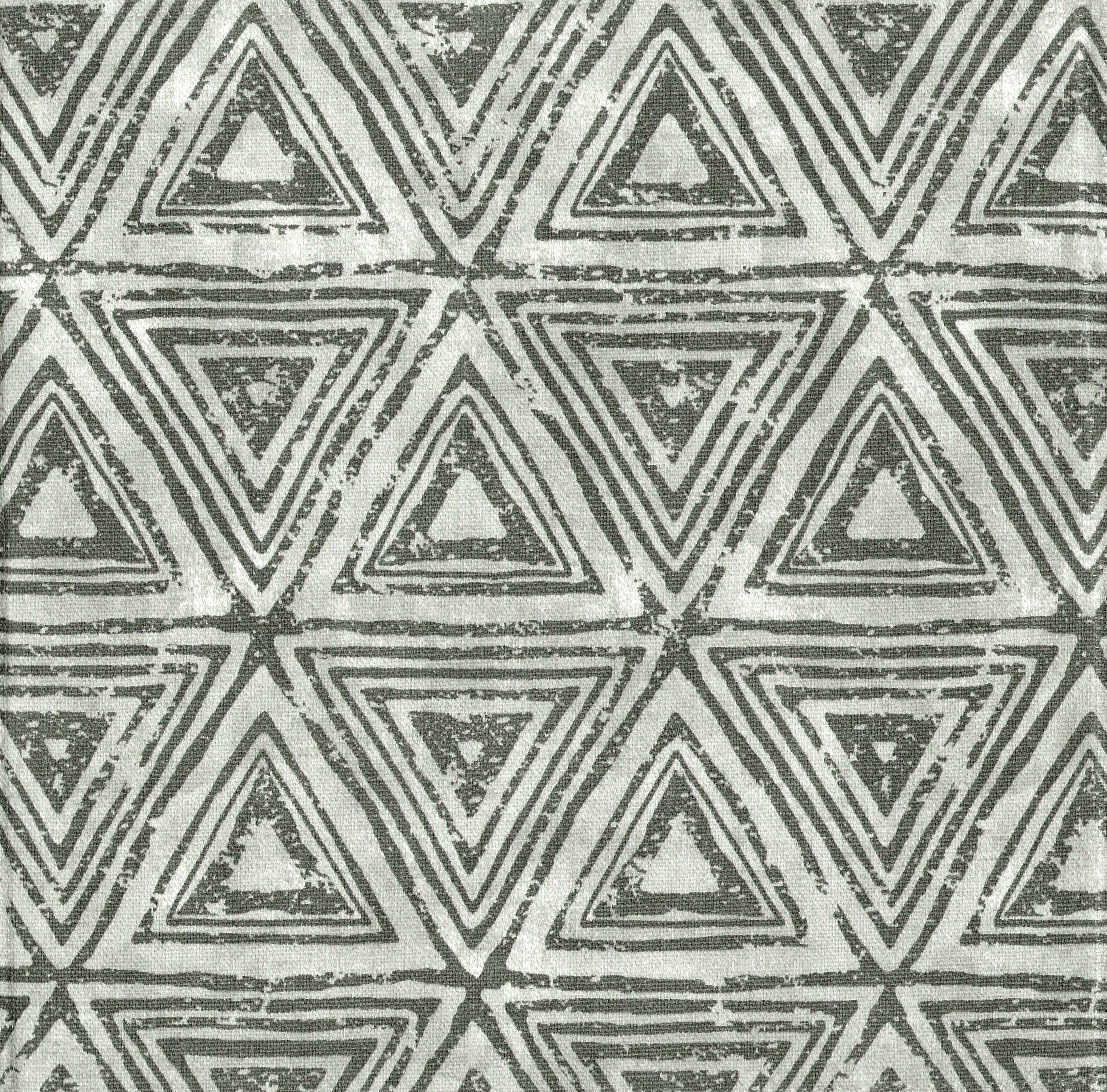 Detail of fabric in a triangular grid print in shades of gray.