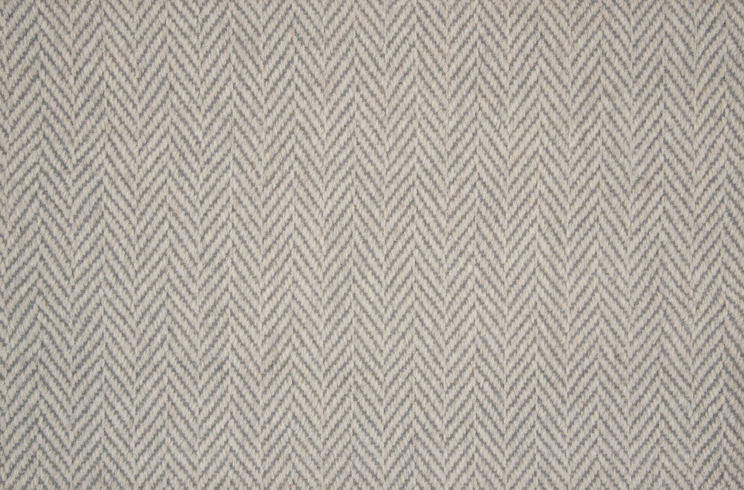 Broadloom carpet in a herringbone pattern in grey.