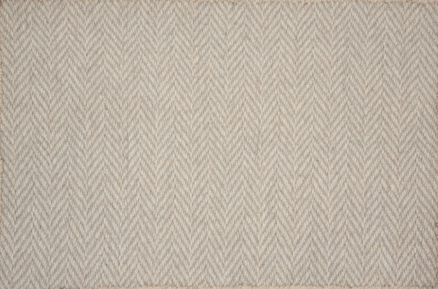 Broadloom carpet in a herringbone pattern in soft beige.