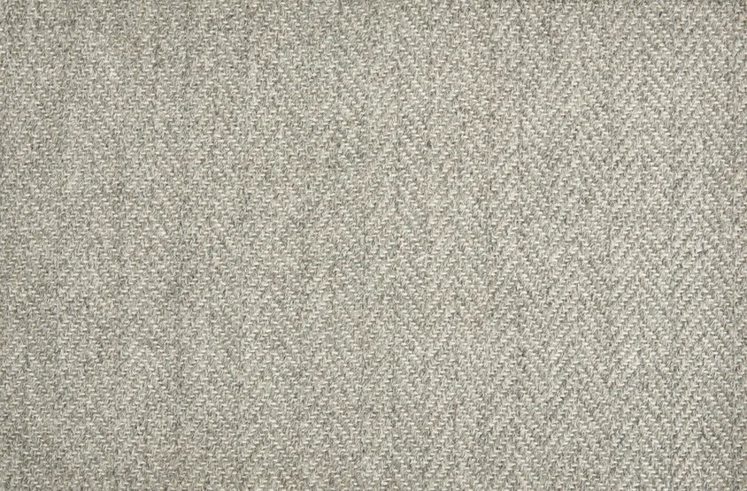 Broadloom carpet in a herringbone pattern in heather grey.