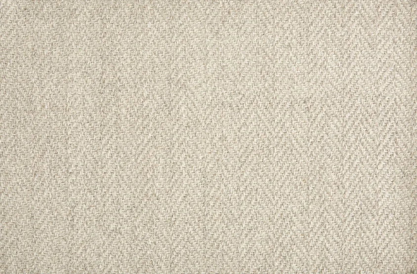 Broadloom carpet in a herringbone pattern in ivory.