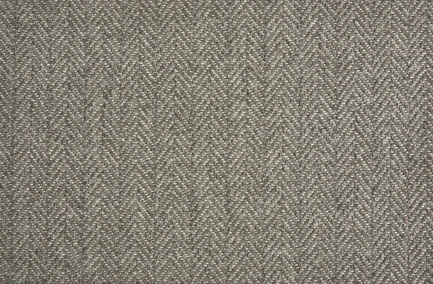 Broadloom carpet in a herringbone pattern in heather grey-brown.