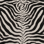 Detail of fabric in a zebra print in black on a white field.