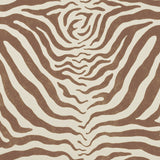 Detail of fabric in a zebra print in brown on a cream field.