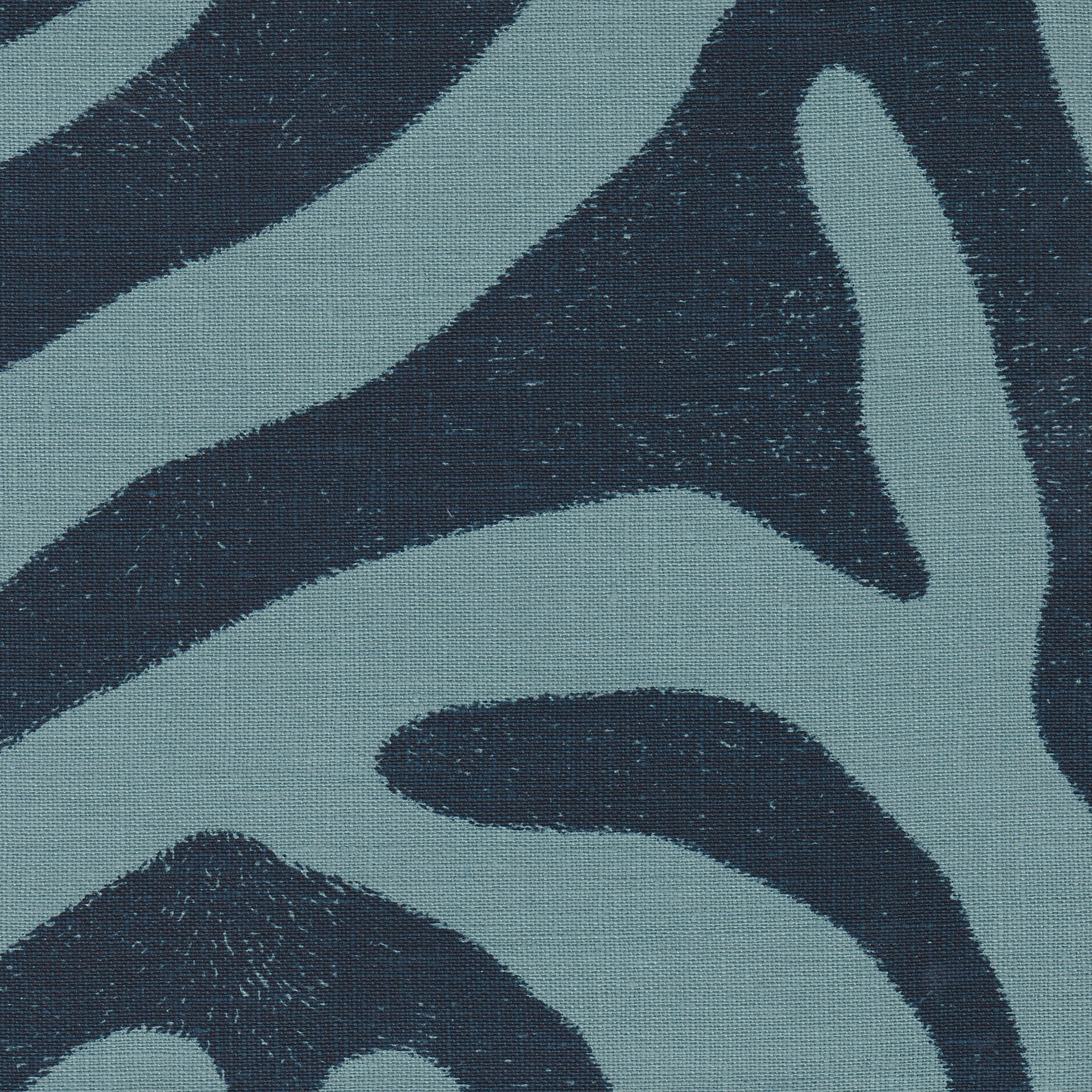 Detail of fabric in a zebra print in navy on a blue field.