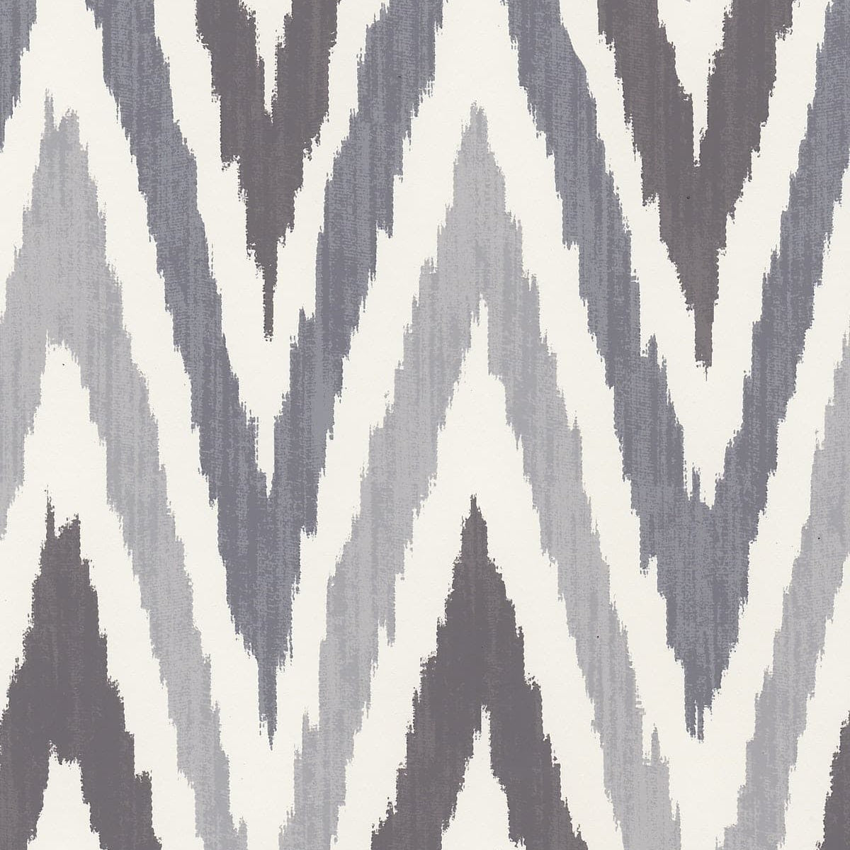 Detail of wallpaper in a geometric ikat print in shades of gray on a white field.