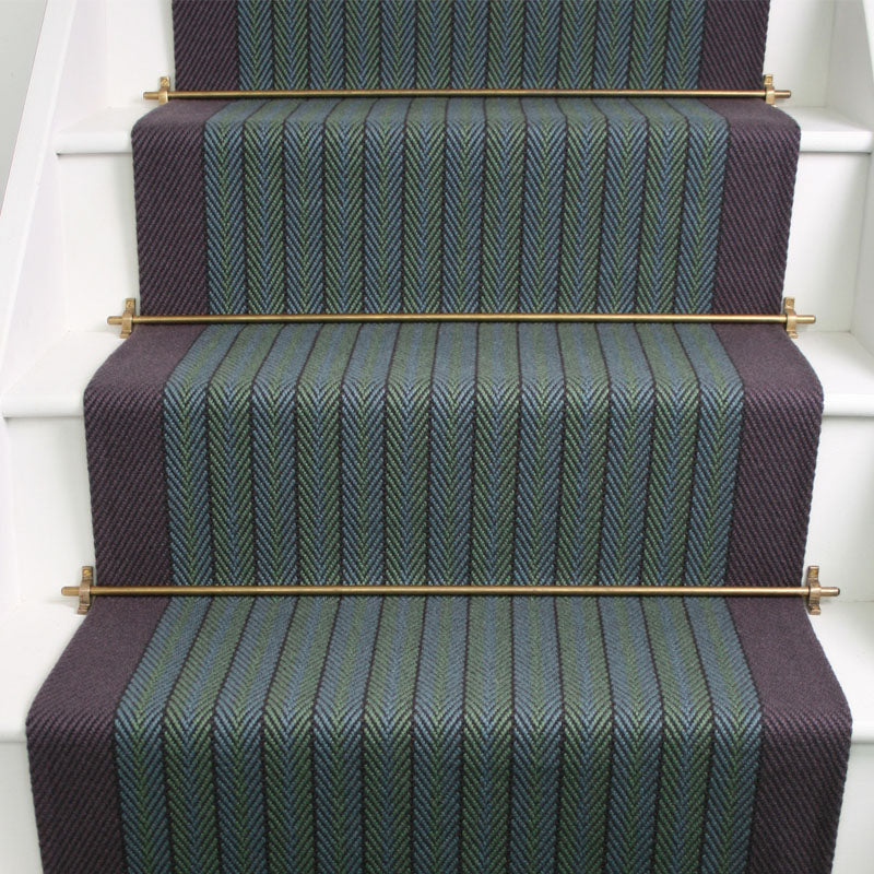 Striped herringbone flatweave runner in green and blue on white staircase