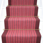 Striped herringbone flatweave runner in pink on white staircase