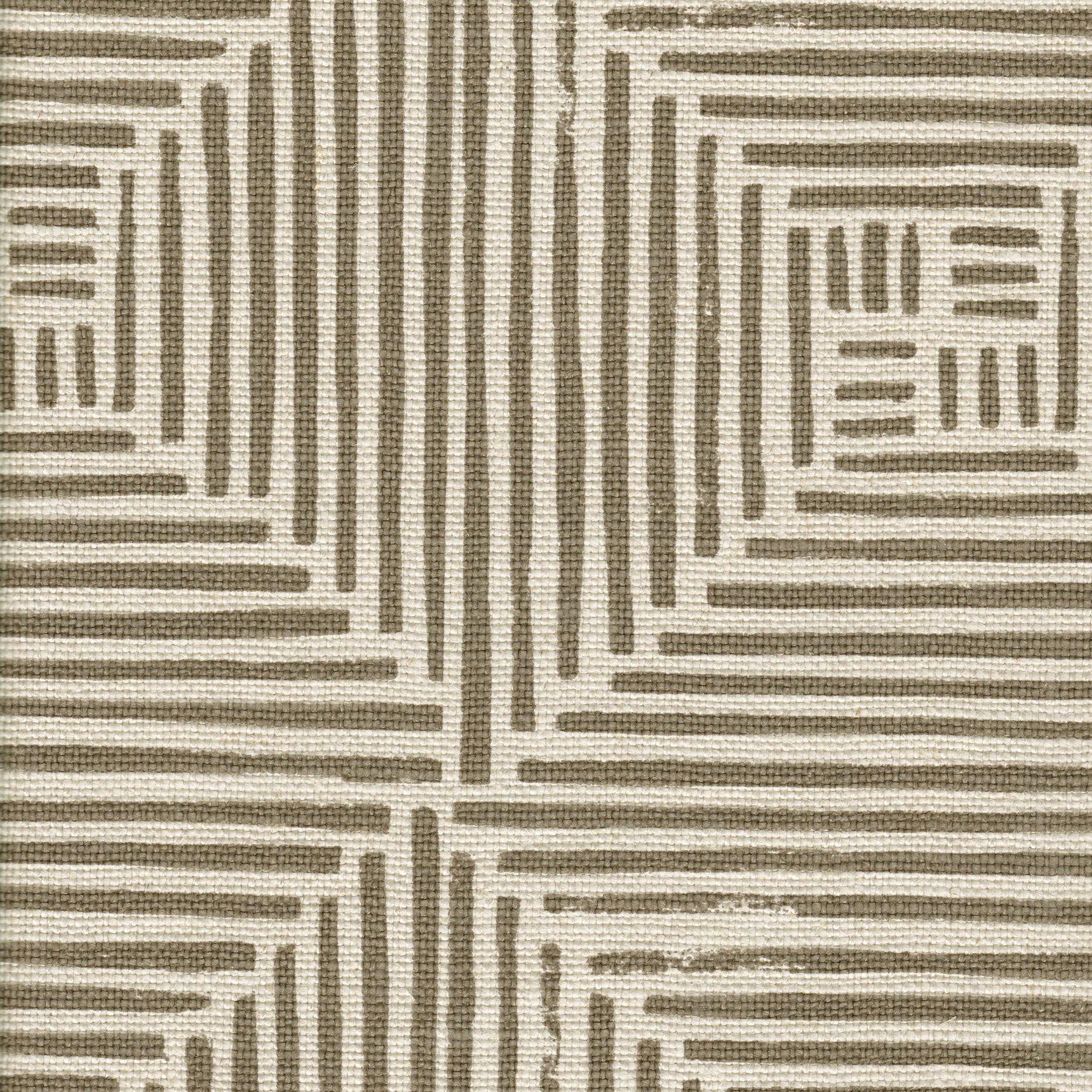 Detail of fabric in a dashed grid print in brown on a cream field.