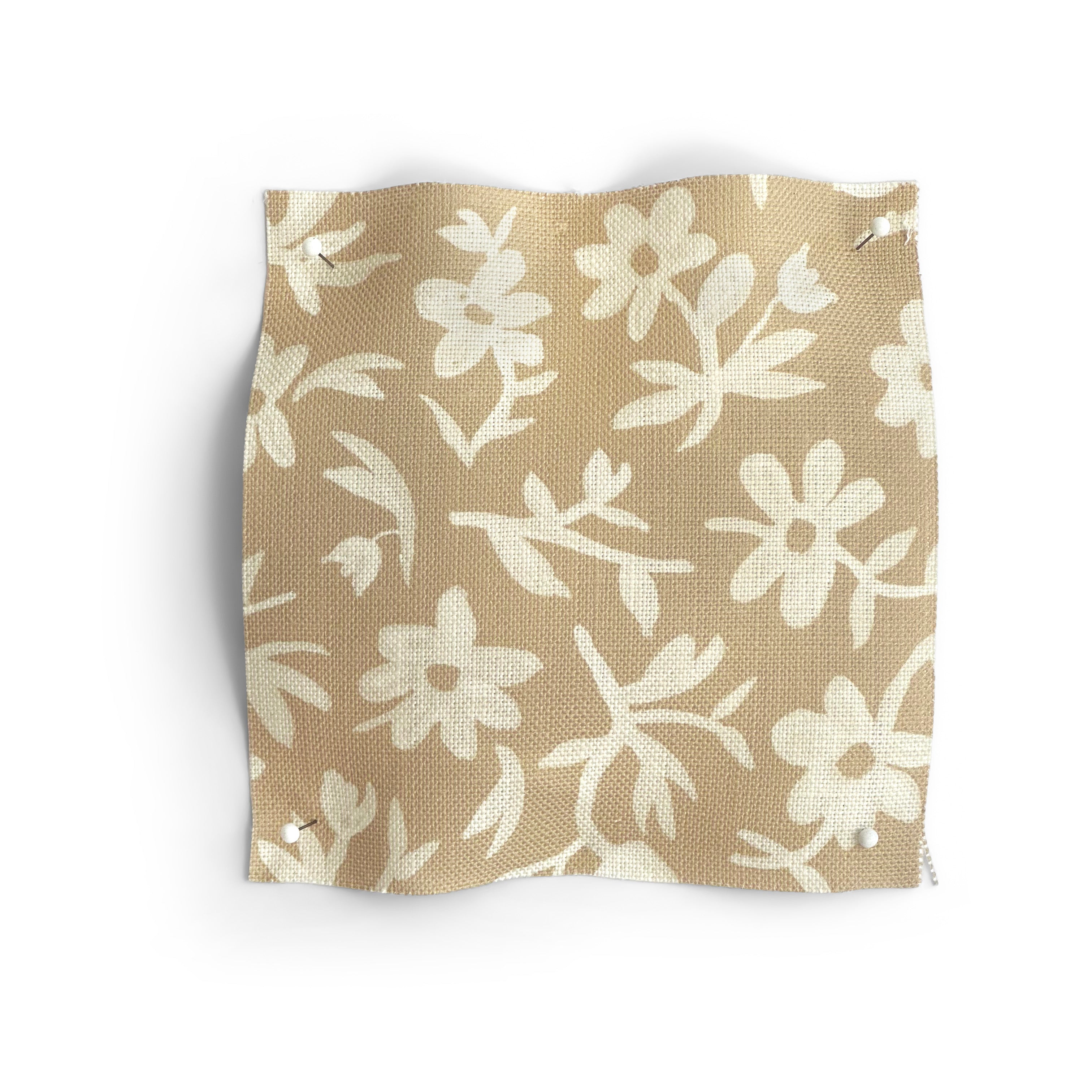 Fabric swatch with beige and white floral pattern on a white background