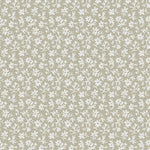 Pattern of small white flowers on a taupe background