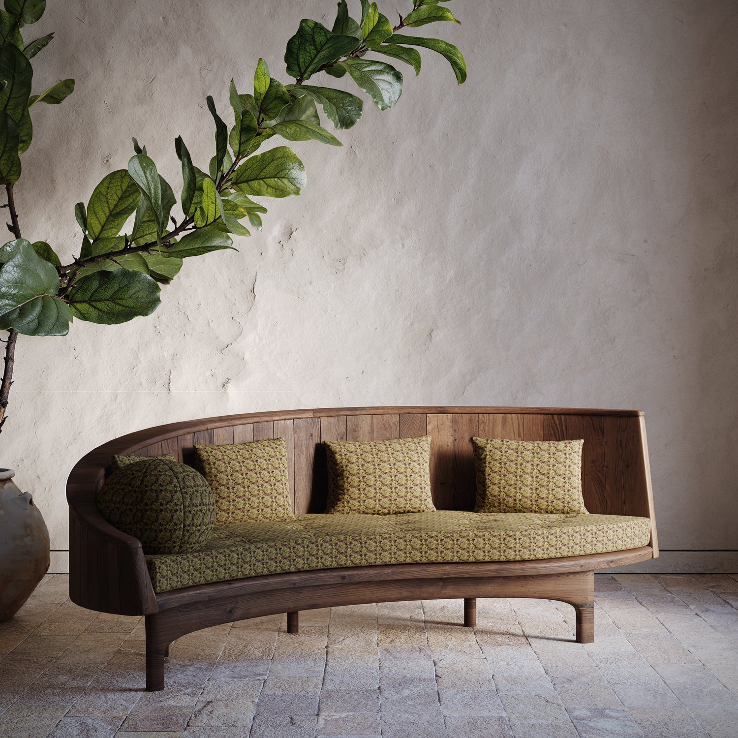 Curved wooden sofa with green cushions against a neutral wall with a plant.