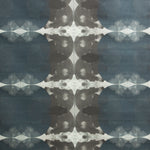 Detail of fabric in a cloudy ink blot print in shades of gray and blue on a light gray field.