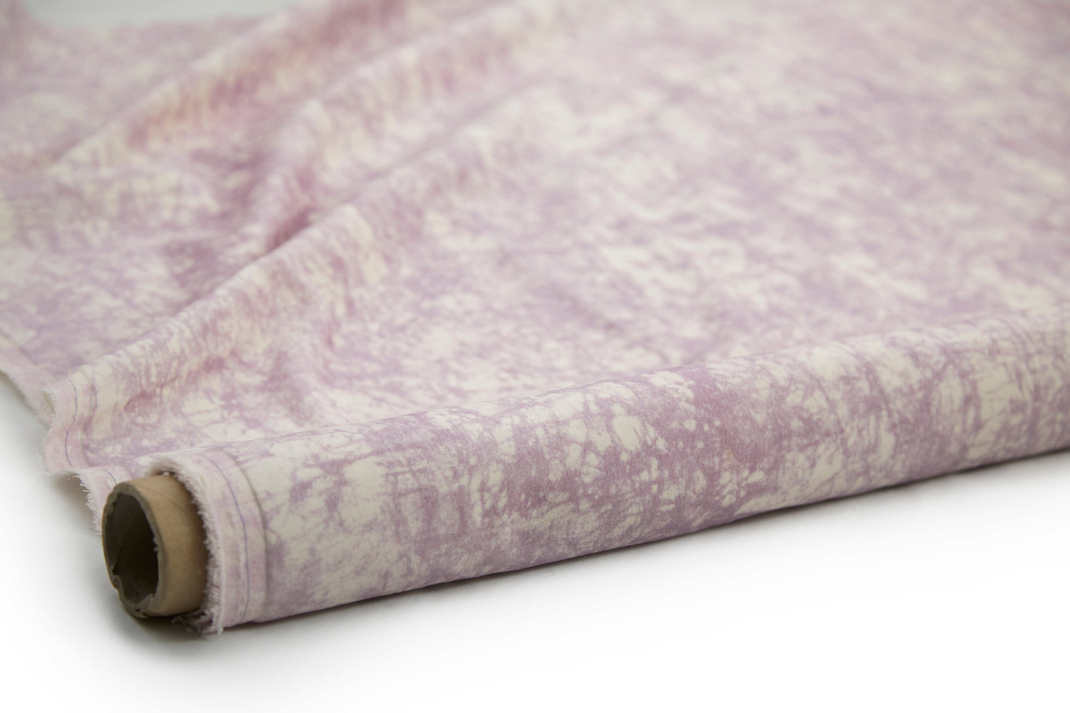 Partially unrolled fabric in an organic crumpled texture in light purple on a cream field.