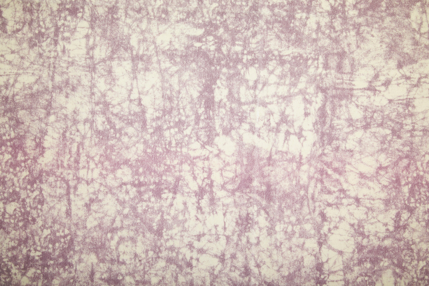 Detail of velvet fabric in an organic crumpled texture in light purple on a cream field.