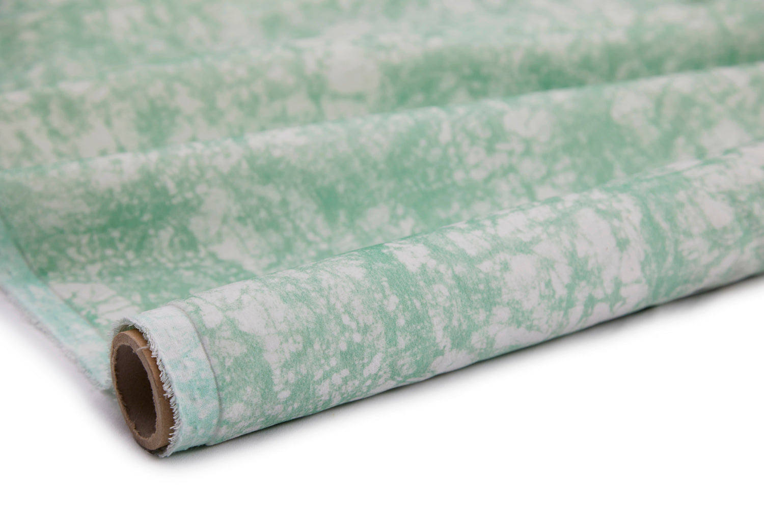 Partially unrolled fabric in an organic crumpled texture in light green on a cream field.