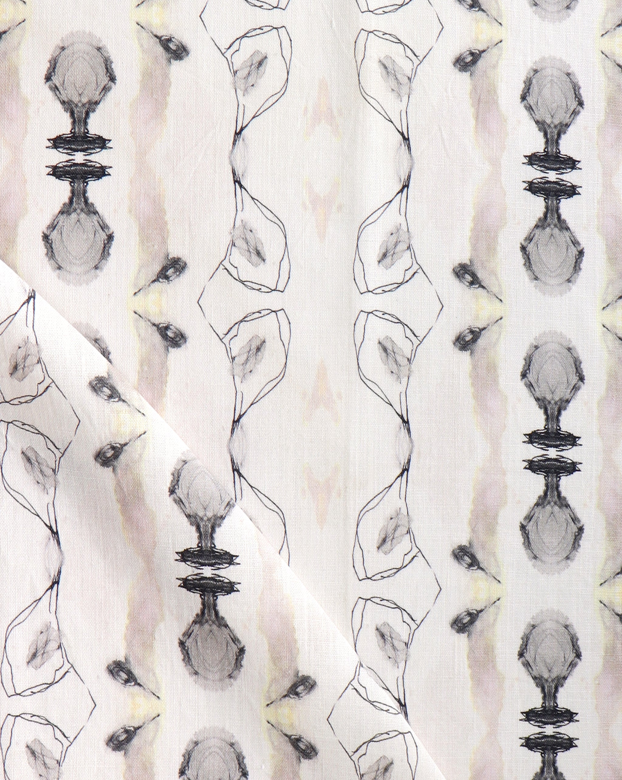 Detail of draped fabric yardage in an abstract ikat stripe print in shades of cream, pink and gray on a white field.