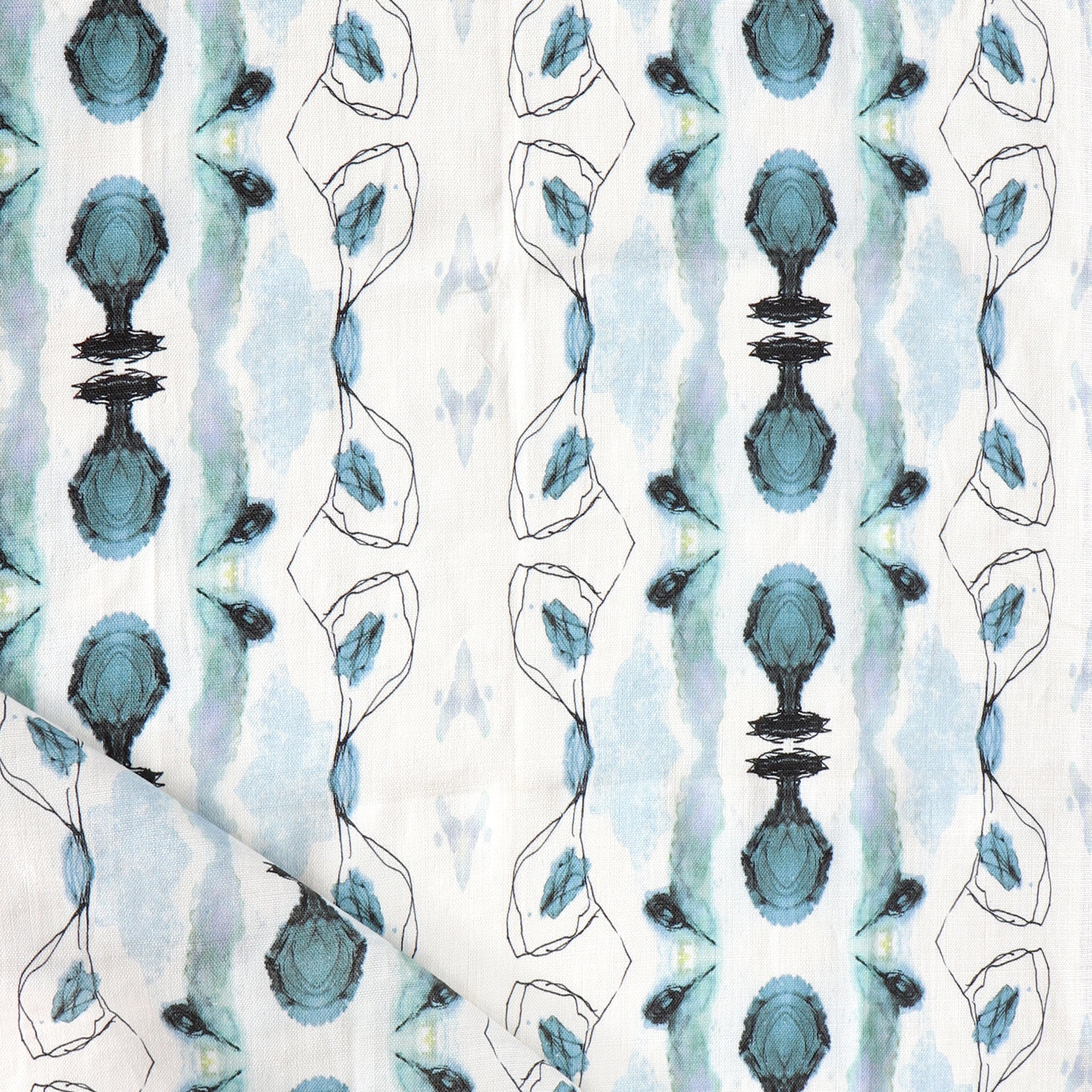 Detail of draped fabric yardage in an abstract ikat stripe print in shades of blue and gray on a white field.