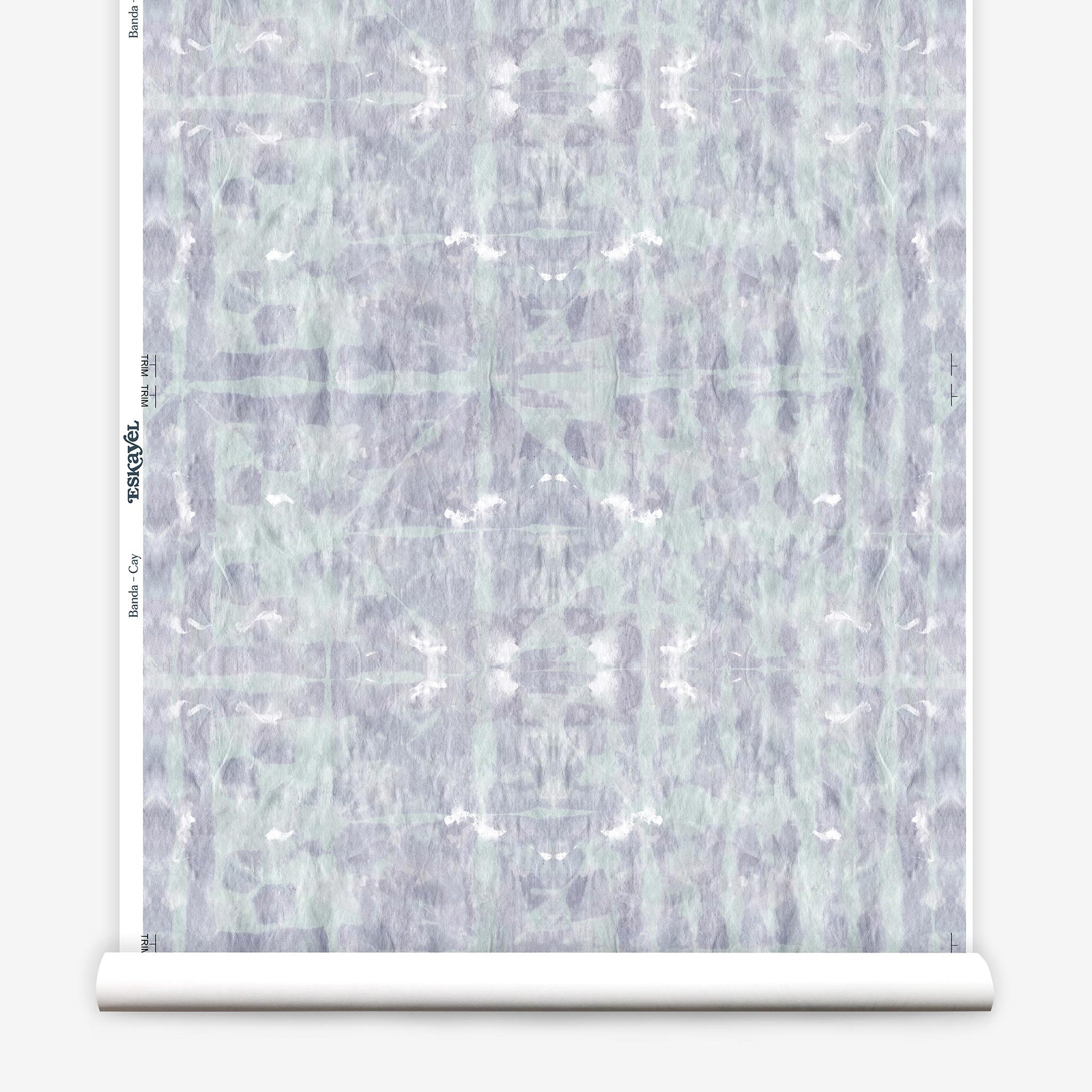 Partially unrolled wallpaper yardage in an abstract dyed grid print in mottled purple and turquoise.