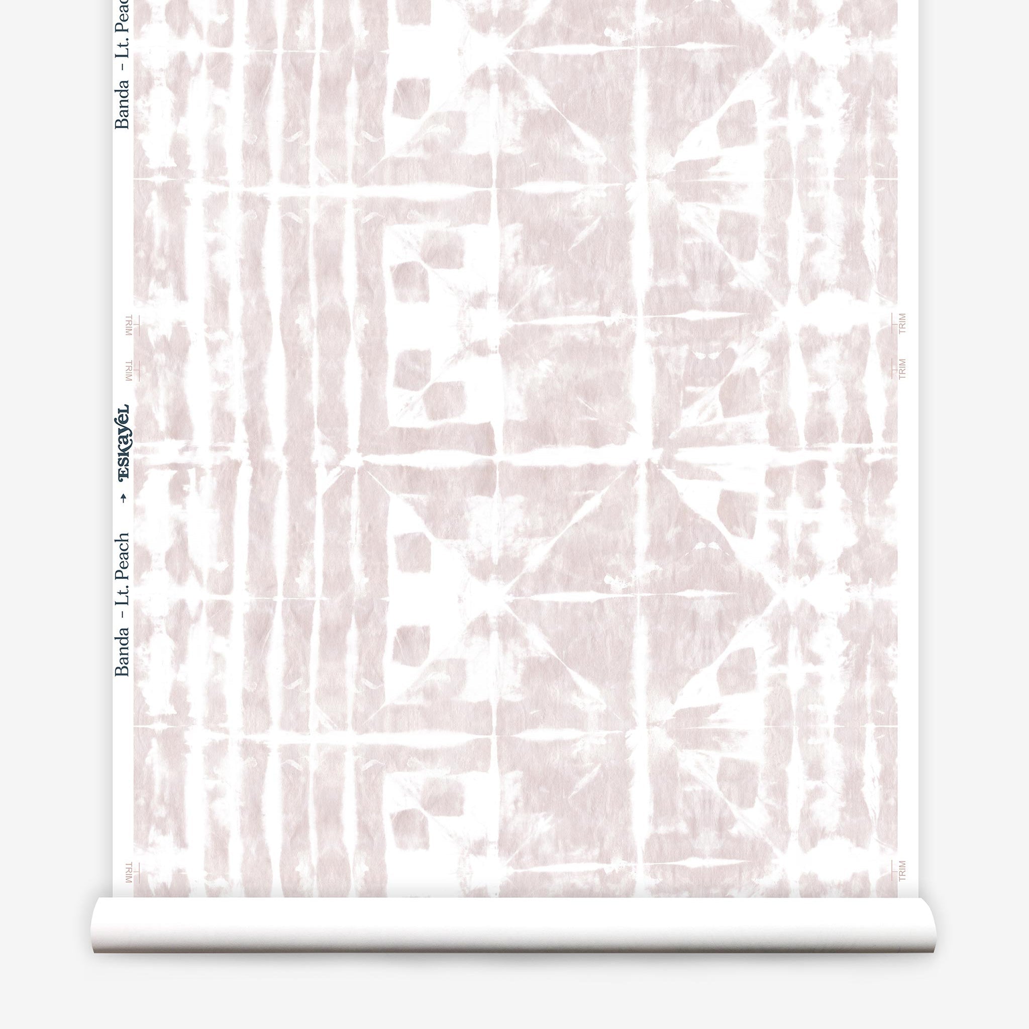 Partially unrolled wallpaper yardage in an abstract dyed grid print in mottled white and pink.