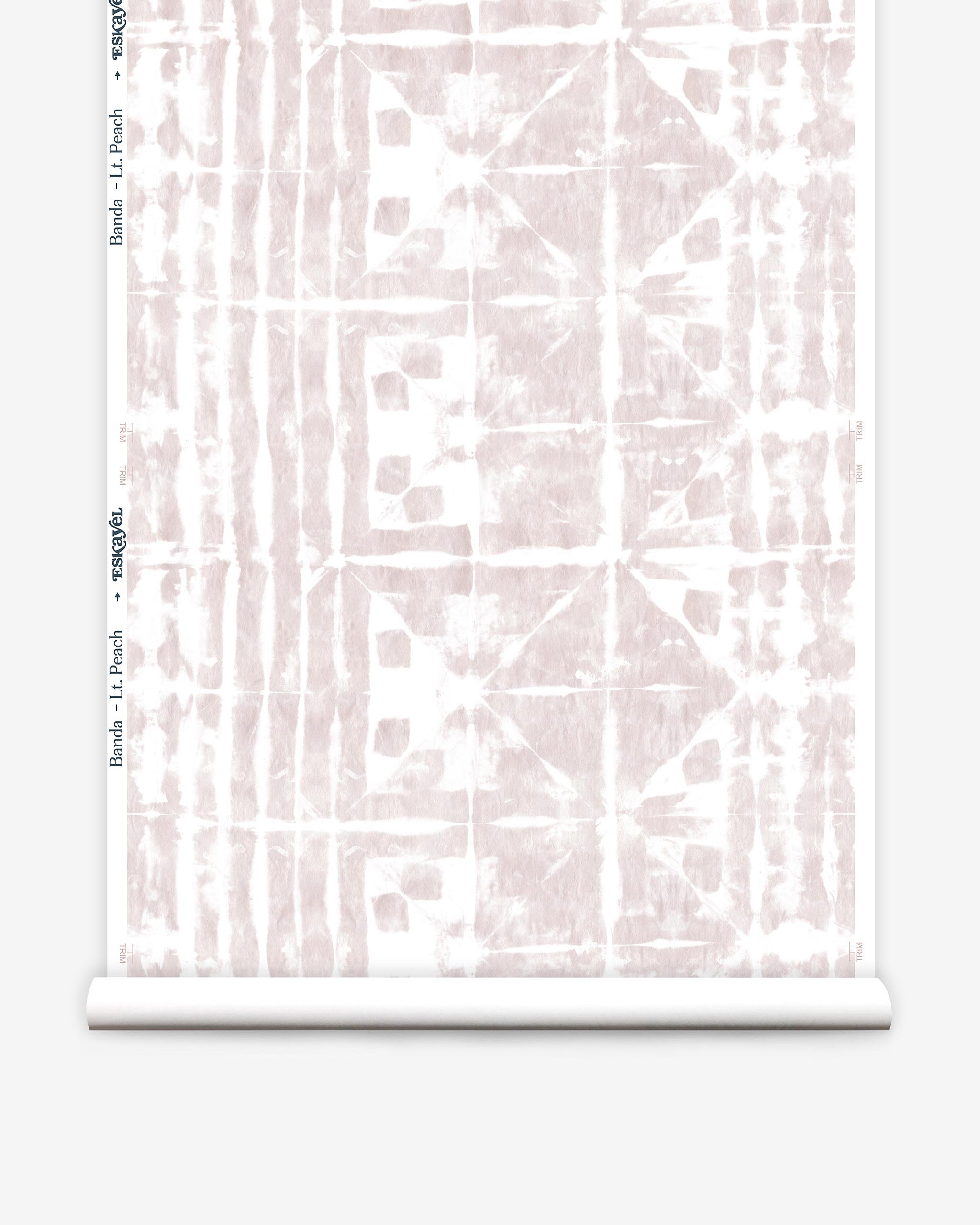 Partially unrolled wallpaper yardage in an abstract dyed grid print in mottled white and pink.