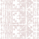 Detail of wallpaper in an abstract dyed grid print in mottled white and pink.