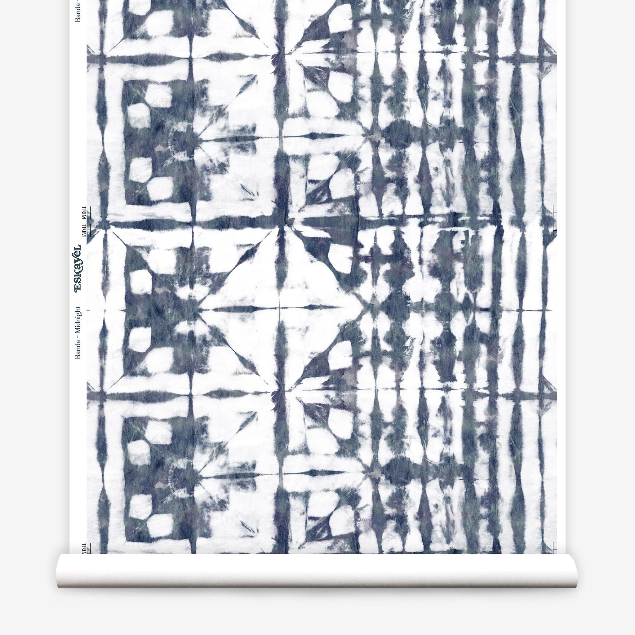 Partially unrolled wallpaper yardage in an abstract dyed grid print in mottled white and navy.