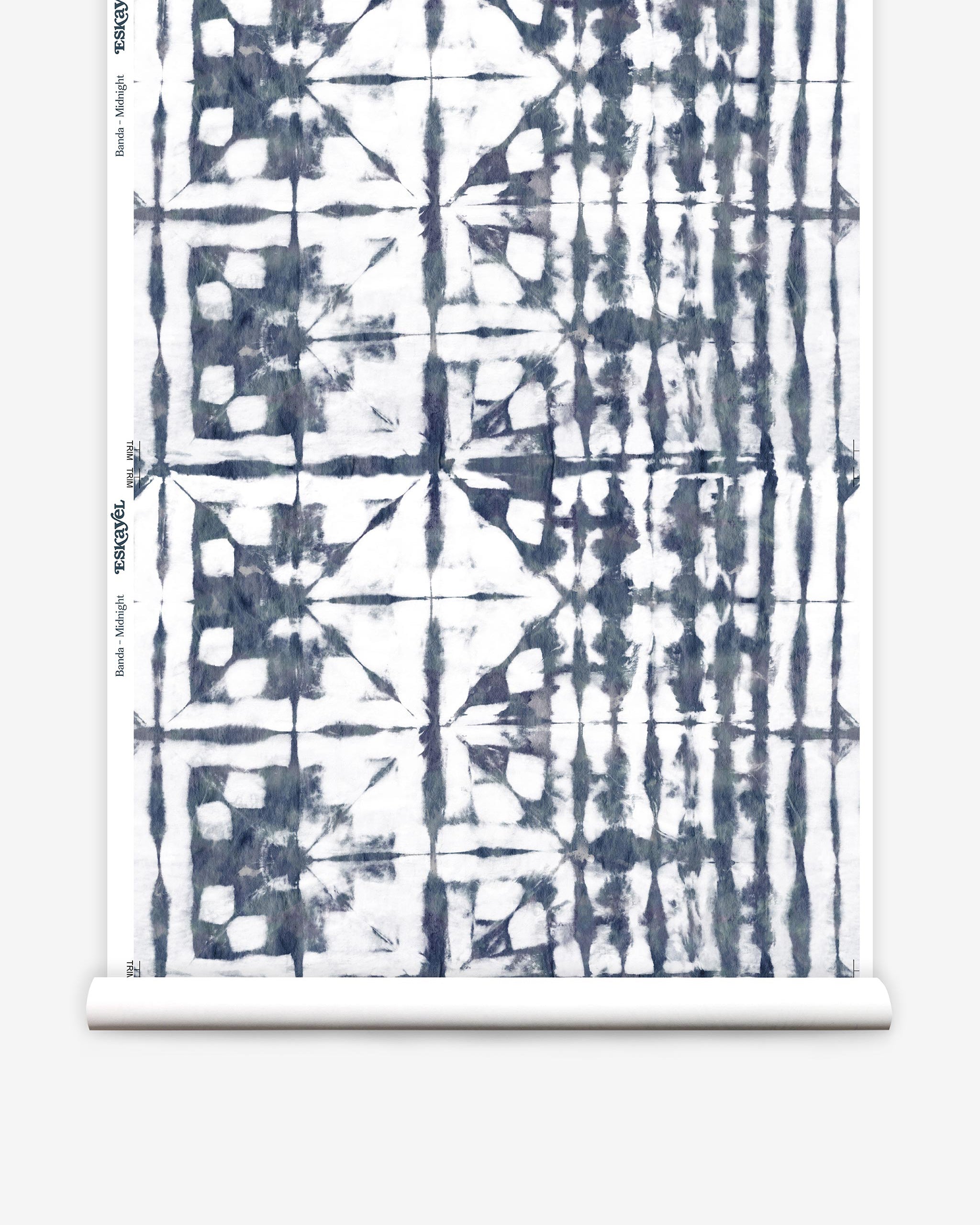 Partially unrolled wallpaper yardage in an abstract dyed grid print in mottled white and navy.