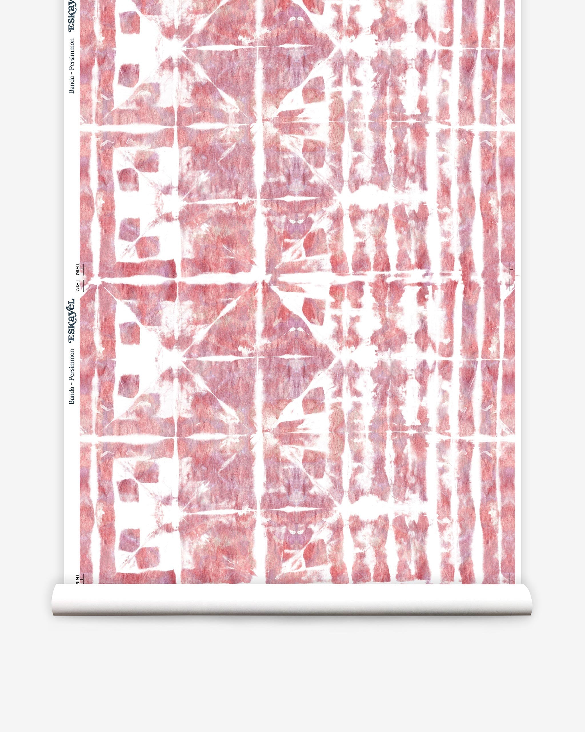 Partially unrolled wallpaper yardage in an abstract dyed grid print in mottled white, pink and red.