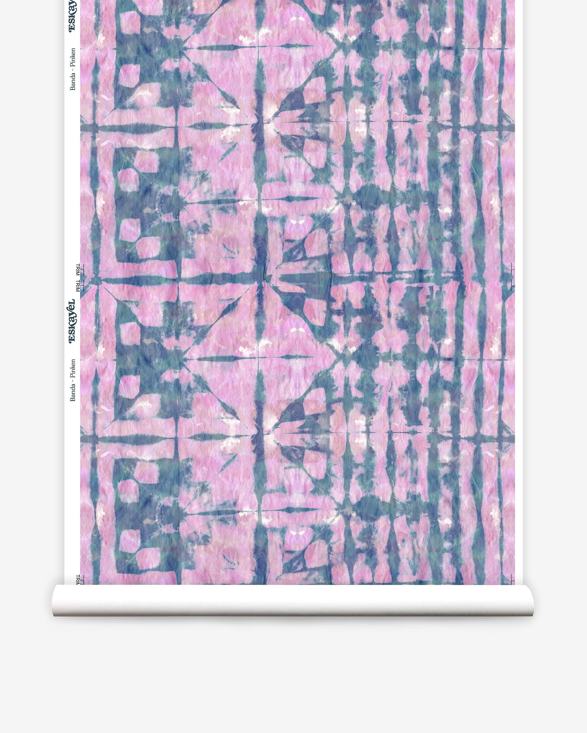 Partially unrolled wallpaper yardage in an abstract dyed grid print in mottled pink and navy.