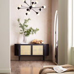 A modernist living space with an accent wall papered in a painterly bandana print in beige and cream.