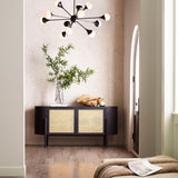 A modernist living space with an accent wall papered in a painterly bandana print in beige and cream.