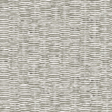 Detail of wallpaper in a textural checked print in mottled gray on a white field.