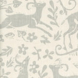 Close-up of fabric in a deer, leaf and flower print in light gray on a cream field.