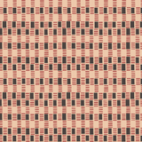 Detail of fabric in a geometric check print in shades of pink, tan and black.