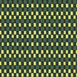 Detail of fabric in a geometric check print in shades of green, yellow and black.