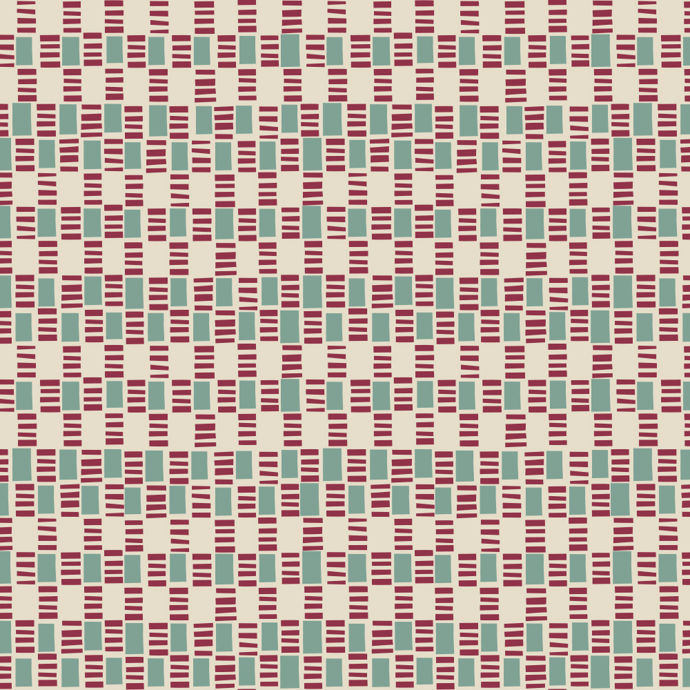 Detail of fabric in a geometric check print in shades of red, cream and turquoise.