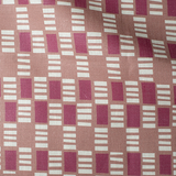 Draped fabric in a geometric check print in shades of red, cream and tan.