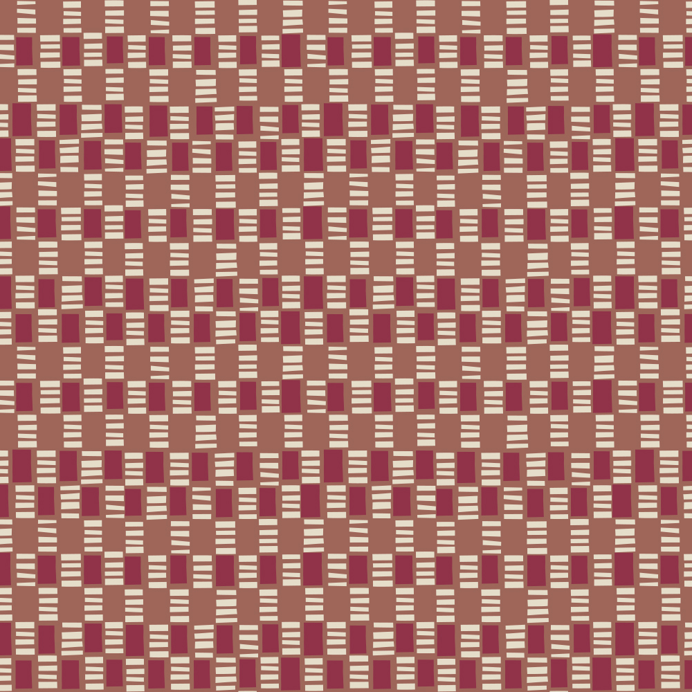 Detail of fabric in a geometric check print in shades of red, cream and tan.