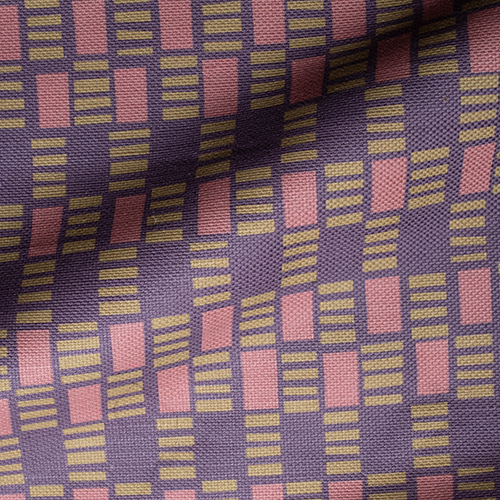 Draped fabric in a geometric check print in shades of pink, purple and gold.