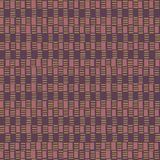 Detail of fabric in a geometric check print in shades of pink, purple and gold.