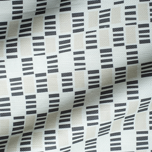 Draped fabric in a geometric check print in shades of cream, white and black.